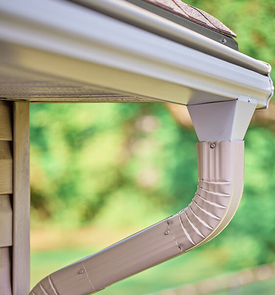 Leafguard gutter with downspout