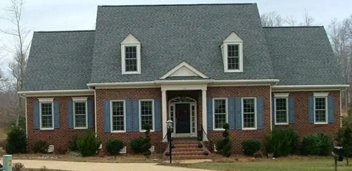 Leafguard gutters shown on a explanded cape house